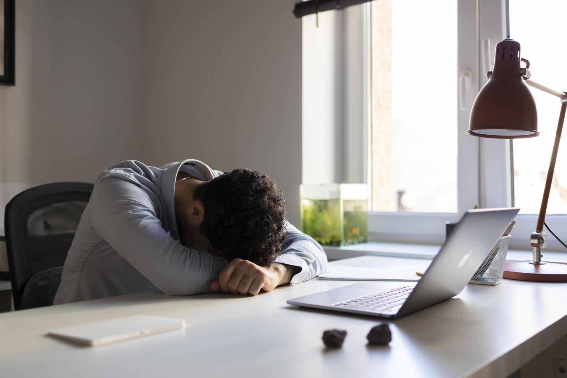 side-view-anxious-man-desk