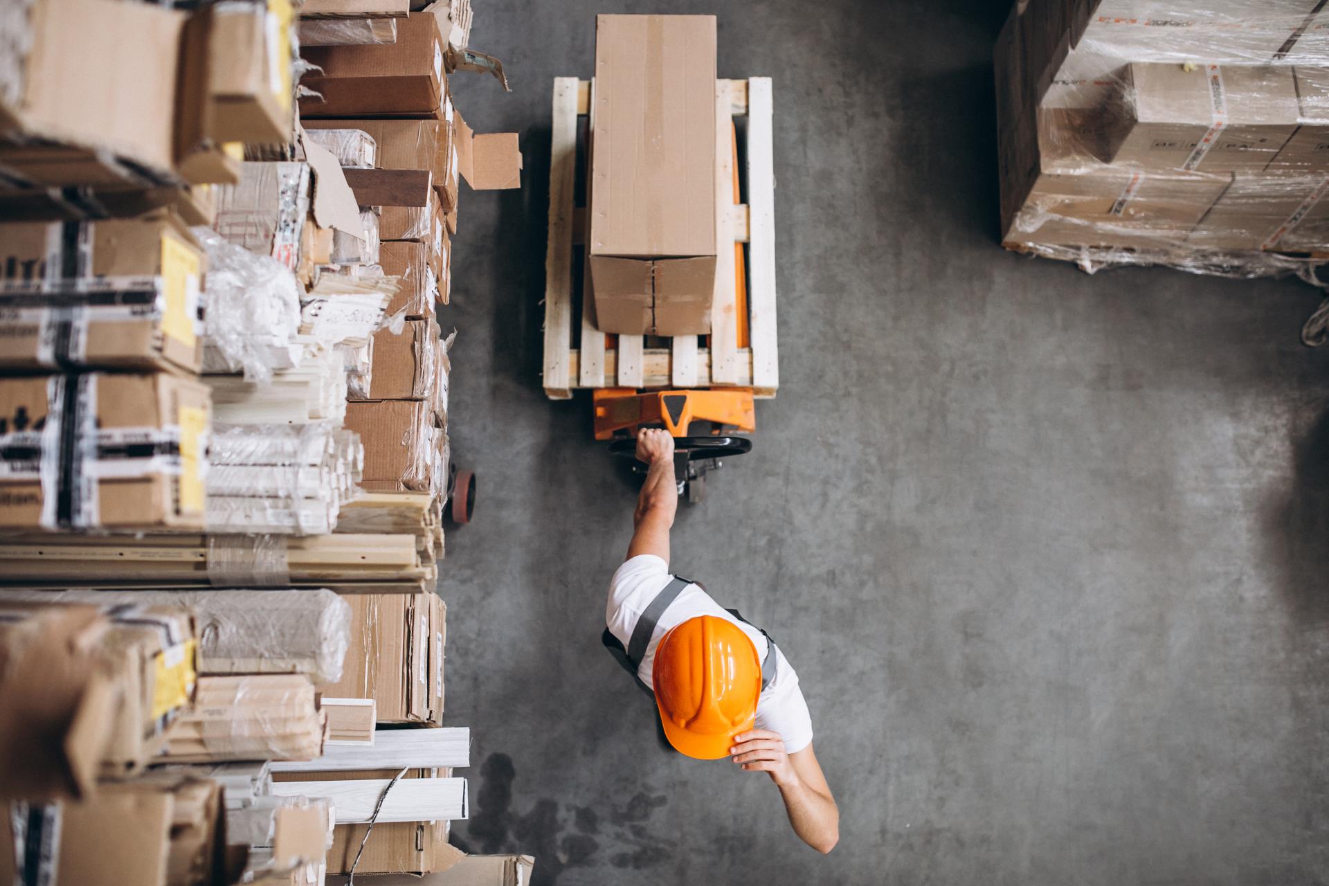 young-man-working-warehouse-with-boxes