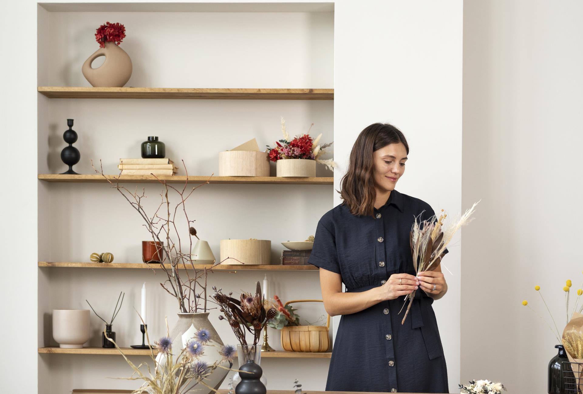 smiley-woman-working-with-flowers-front-view