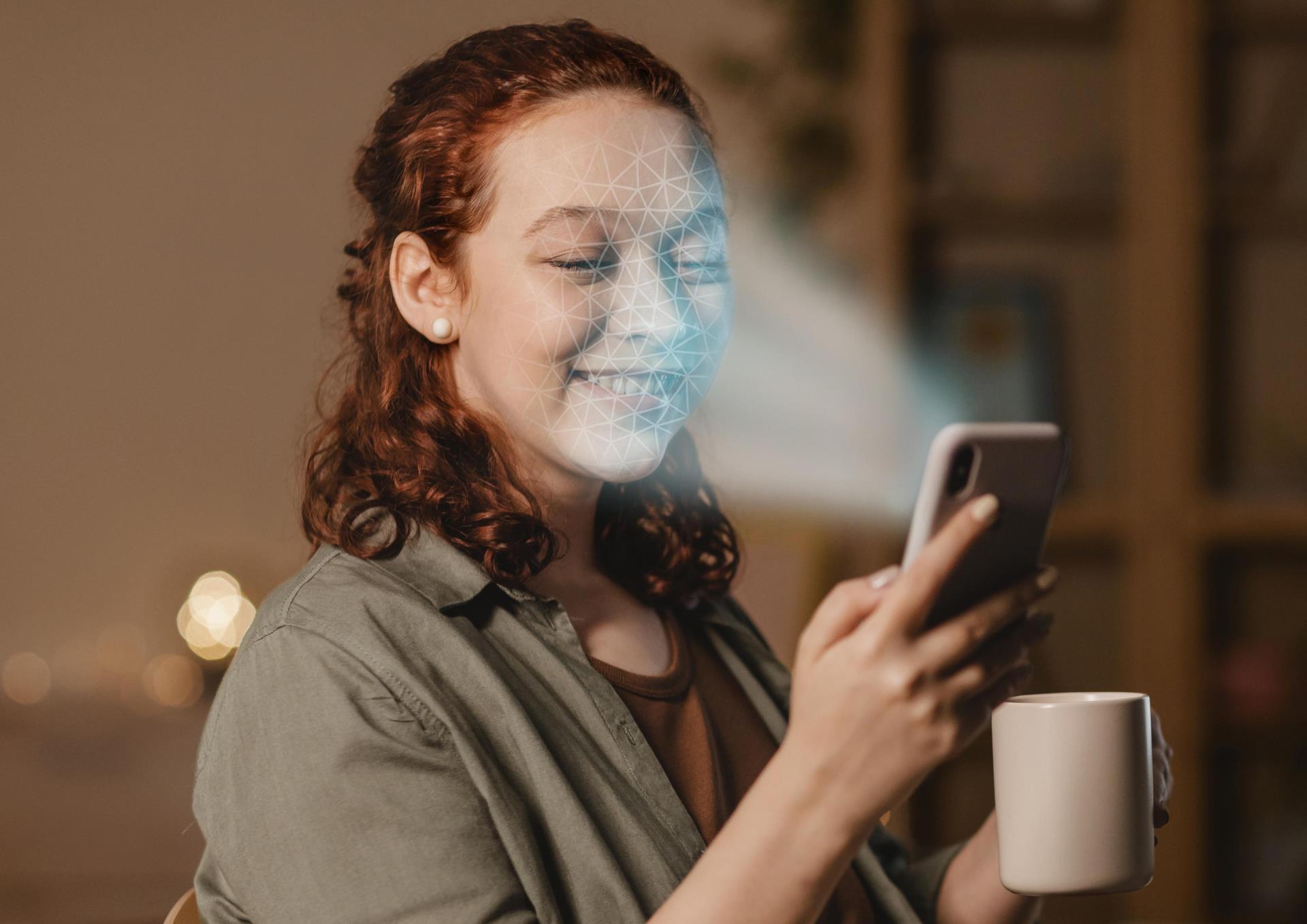 woman-with-phone-doing-face-scan