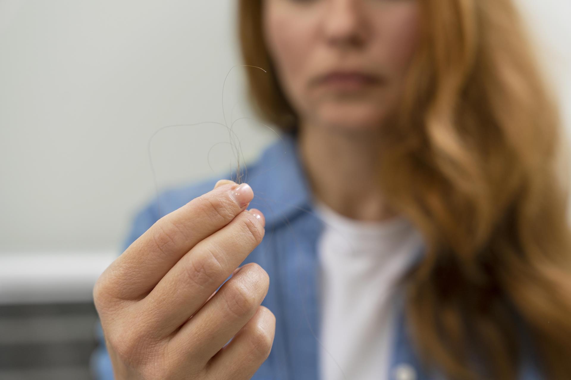 woman-getting-hair-loss-treatment-clinic