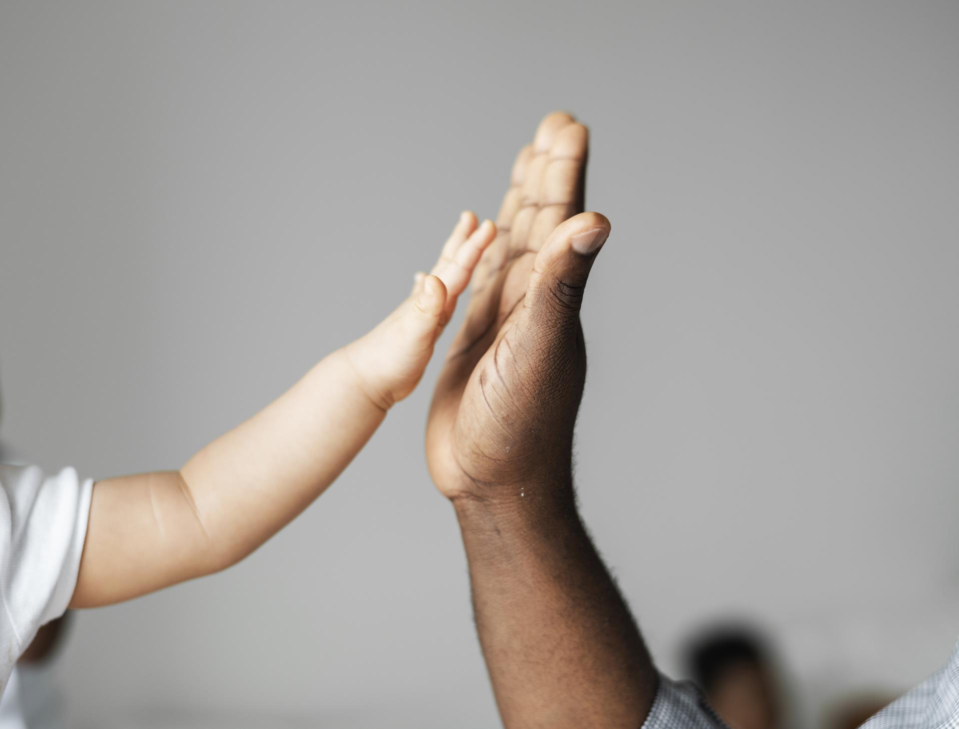 small-big-hands-doing-high-five