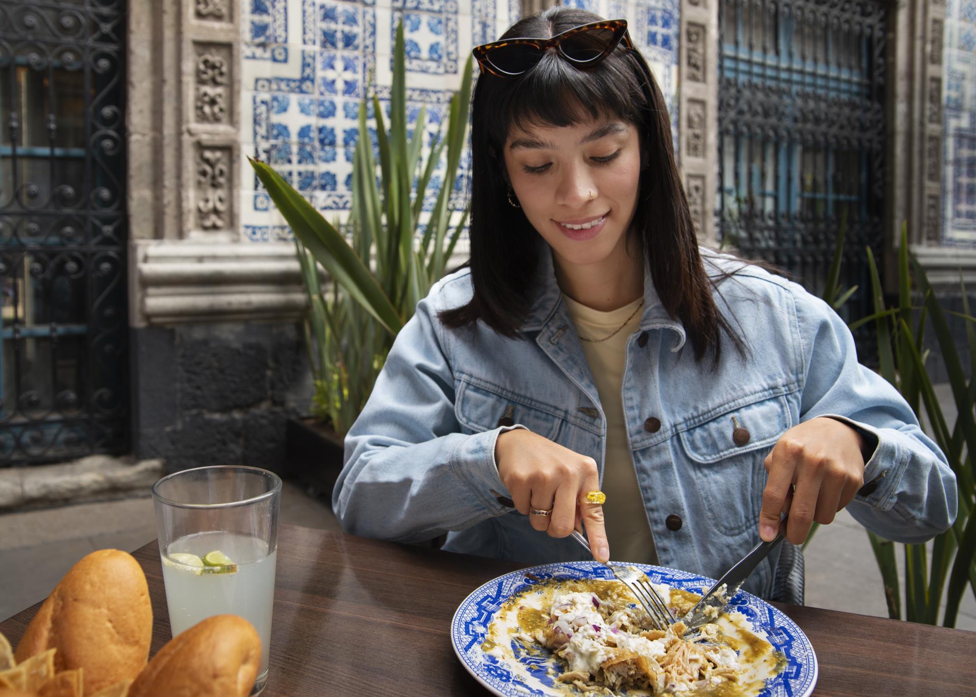 front-view-mexican-woman-eating-ranchero-food