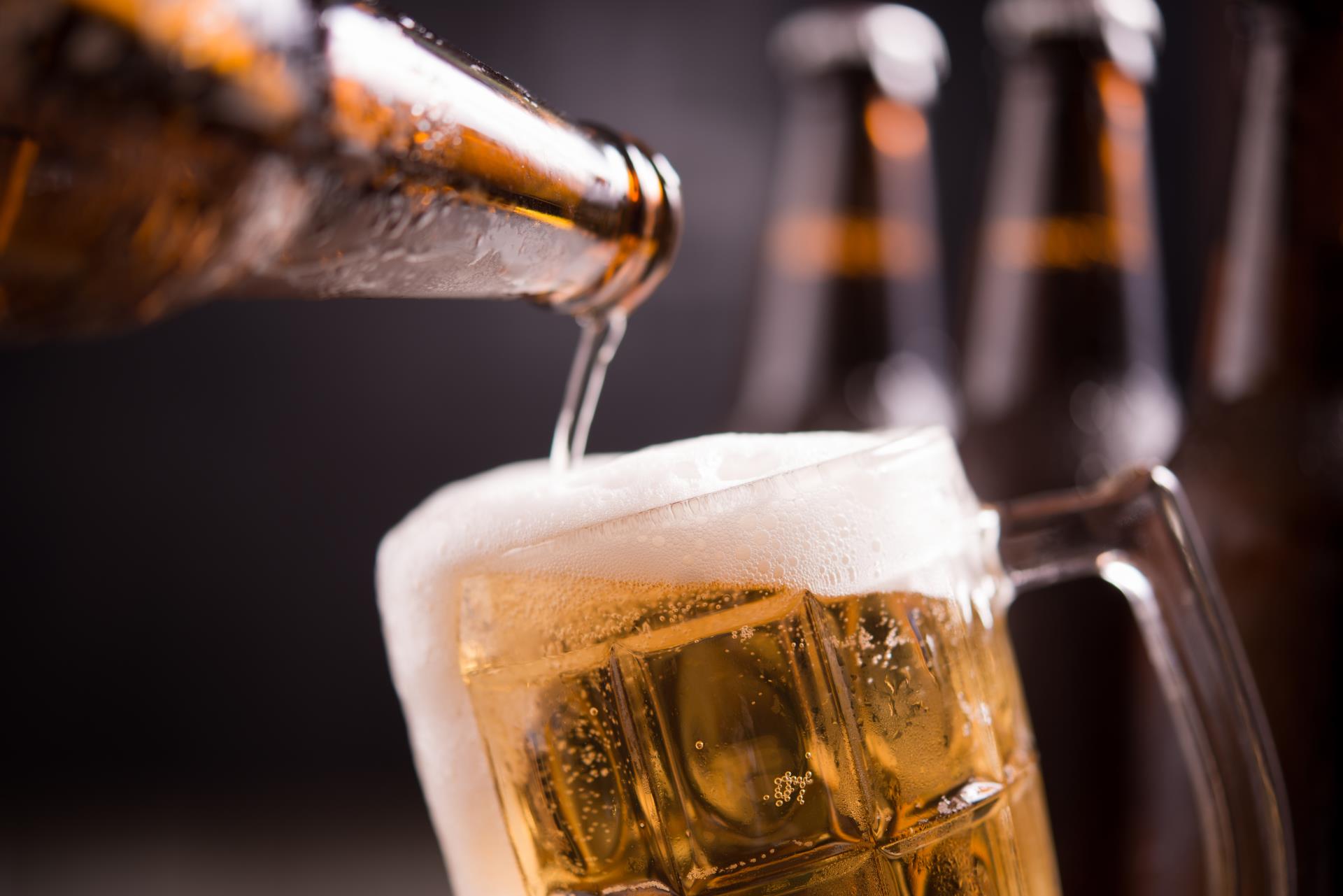 glass-bottles-beer-with-glass-ice-dark-background