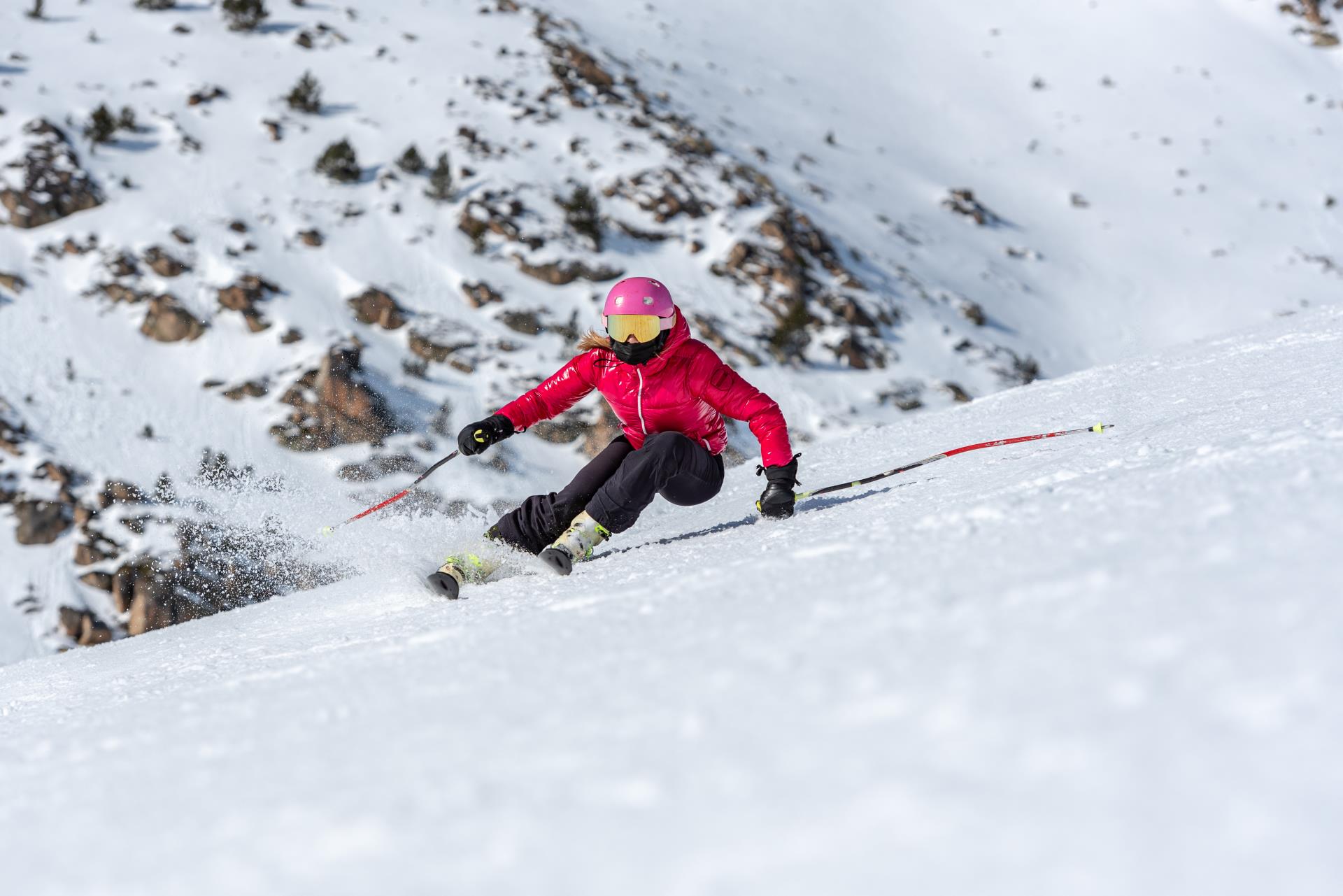 young-blonde-woman-ski-goggles-helmet-skiing-snowy-mountain-slope