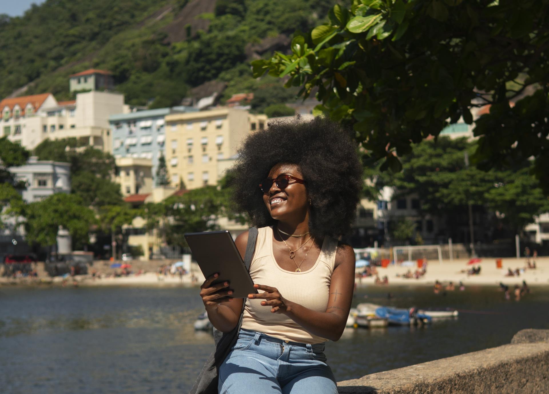 full-shot-woman-reading-tablet