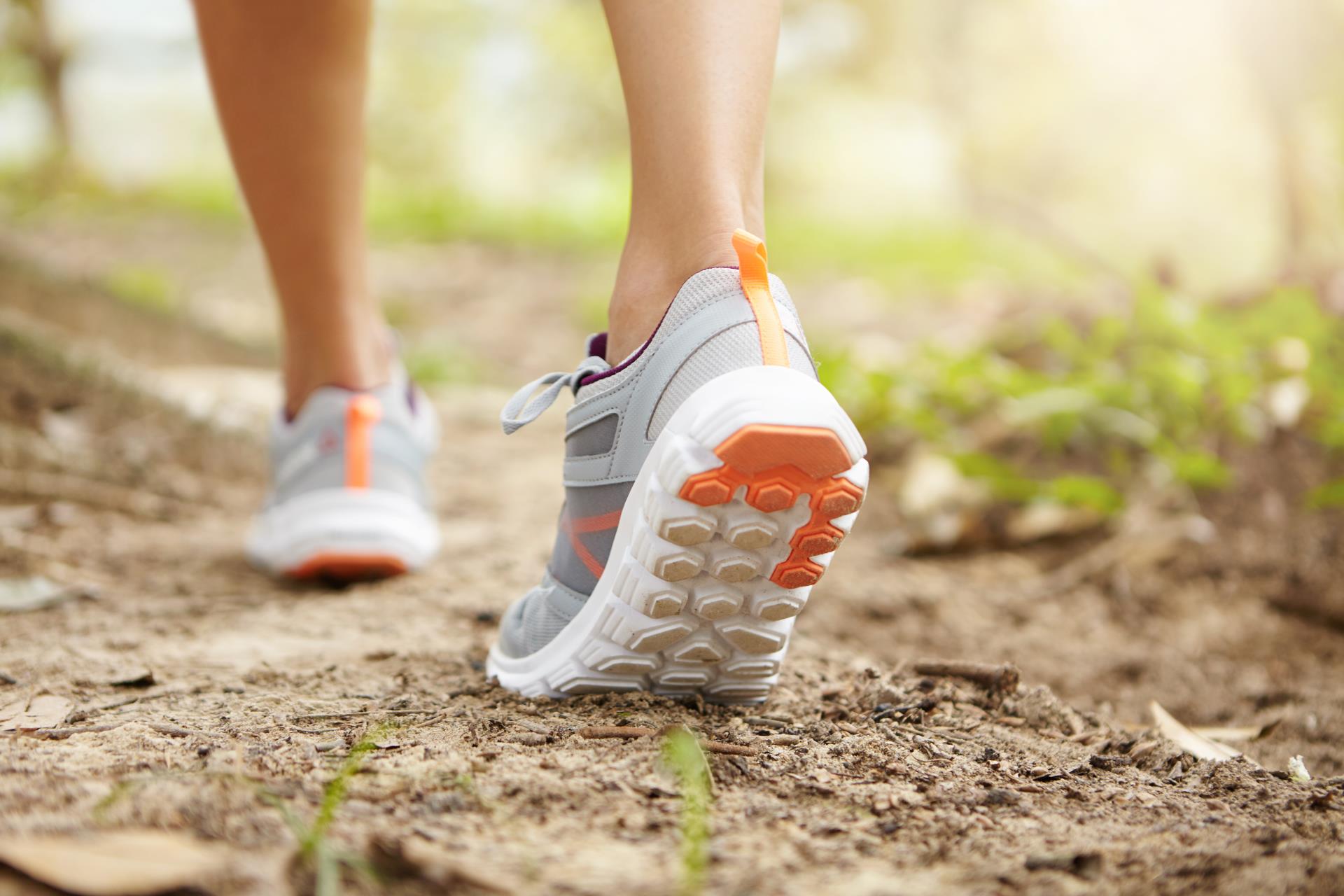rear-cropped-shot-athletic-legs-woman-jogger-wearing-pink-running-shoes-jogging-exercise-outdoors