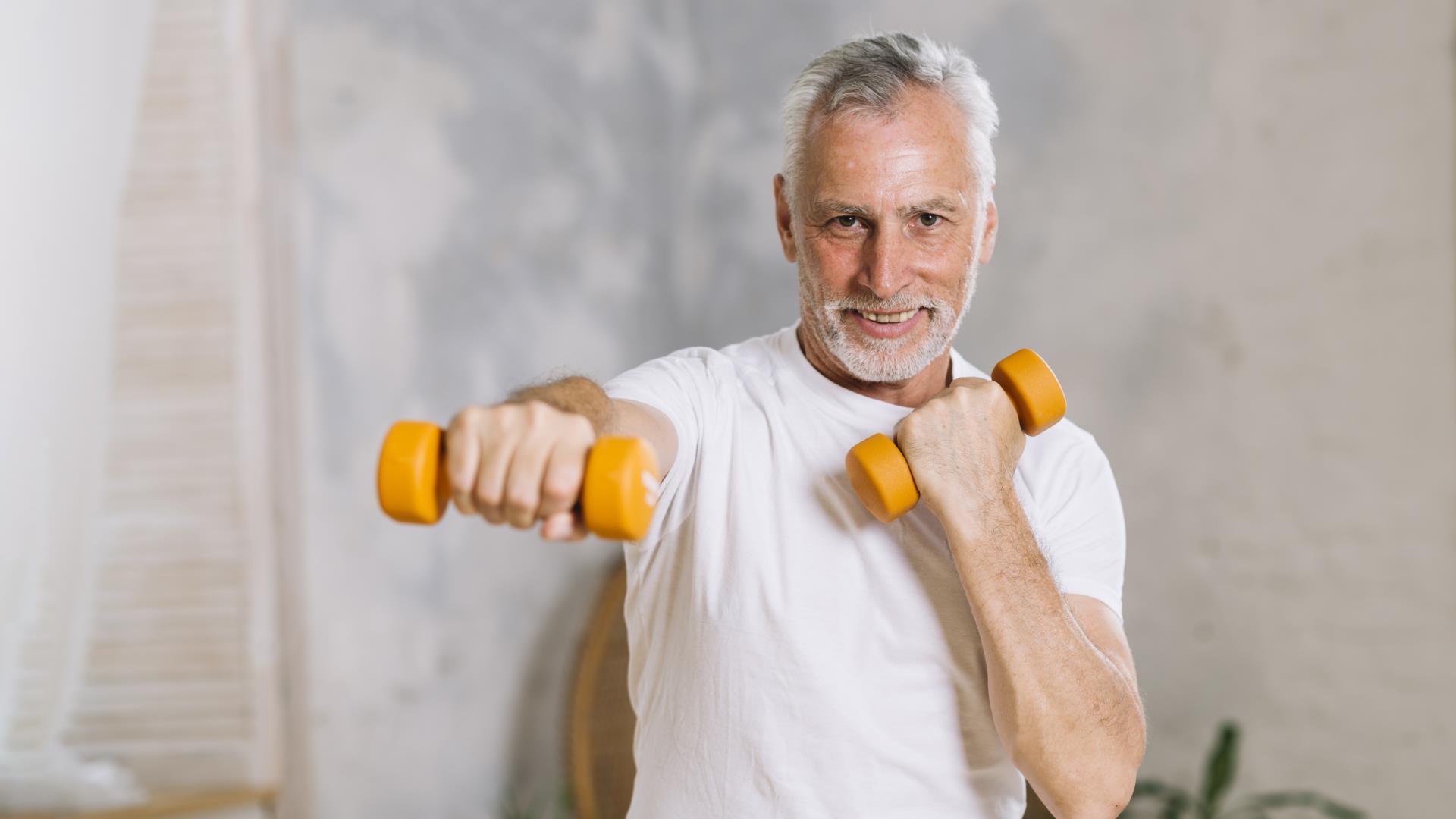 portrait-happy-senior-man-lifting-weights