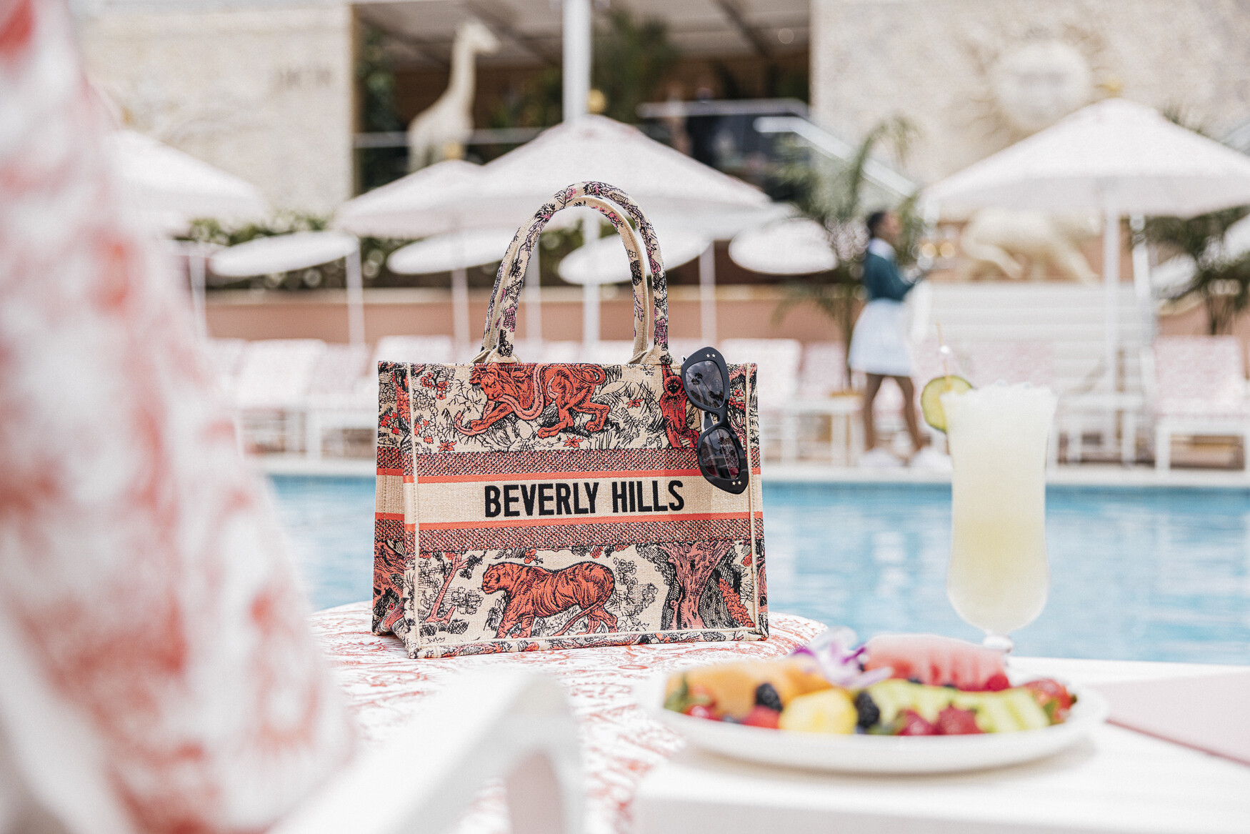 The Beverly Hill Hotel-Dior-pool-lounger-tote-fruit-close-up-Dorchester-Collecttion