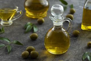 high-view-bottles-filled-with-olive-oil-marble-background