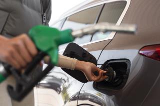 view-woman-with-car-gas-station