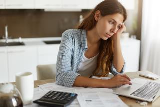 young-woman-checking-her-budget-doing-taxes