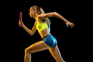 professional-female-relay-racer-training-isolated-black-studio-background-neon-light