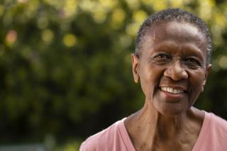 front-view-smiley-black-woman