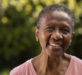 front-view-smiley-black-woman