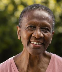 front-view-smiley-black-woman