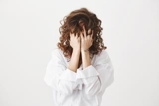 troubled-distressed-woman-press-hands-palms