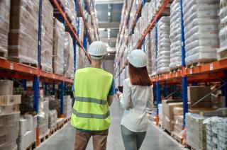 back-view-woman-man-warehouse-aisle