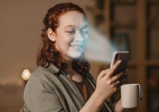 woman-with-phone-doing-face-scan