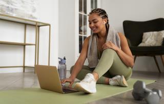 full-shot-woman-training-with-laptop