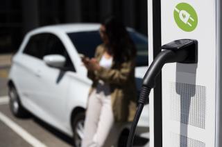 side-view-blurry-woman-waiting-near-car