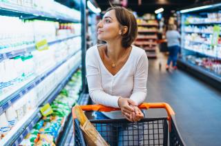 woman-shopping-grocery-store-by-refrigerator