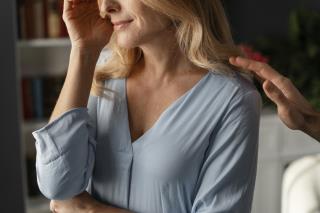 portrait-woman-being-comforted-therapy-office