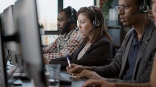 young-woman-using-audio-headset-computer-call-center-job-offering-helpline-assistance-people-female-consultant-talking-clients-customer-care-service-helping-with-telemarketing