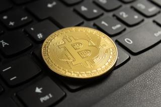 closeup-shot-bitcoin-put-black-computer-keyboard