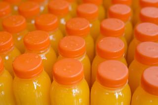 fruit-juice-plastic-bottle-with-orange-closed-lid