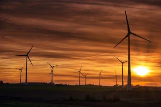 silhouette-windmills-field-sunset