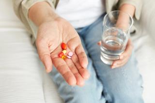 pills-tablets-vitamins-drugs-heap-mature-hands