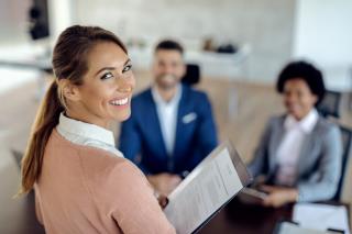 young-happy-woman-having-job-interview-office