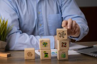 front-view-man-with-wooden-blocks